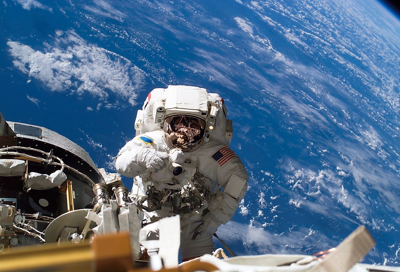 Astronaut Michael A. Lopez-Alegria pauses near the front of the International Space Station during an expedition.