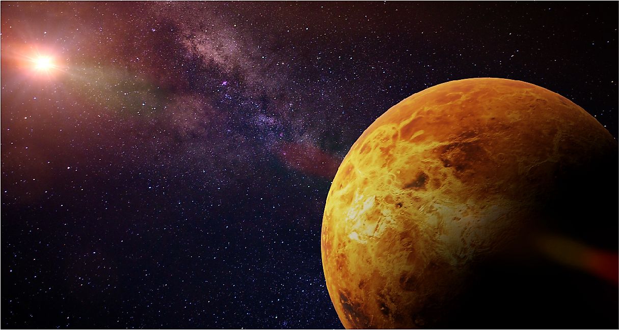Venus, the slowest-spinning planet in the Solar System, illuminated against the Sun and stars.