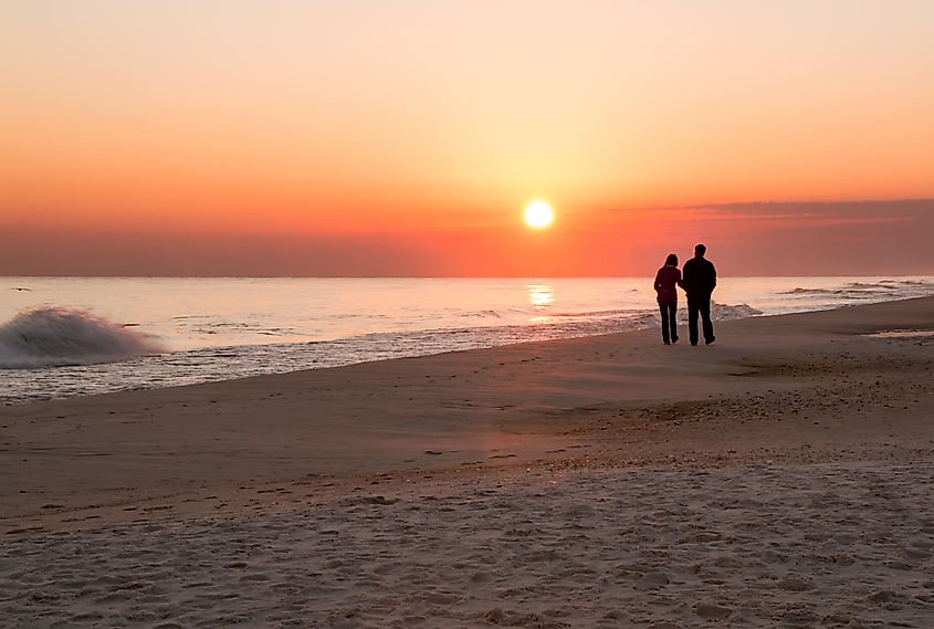 An Earthly couple take a stroll at sunset. Via Shutterstock / Robert H Ellis