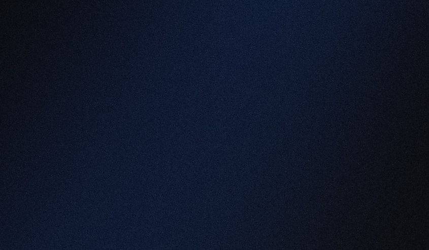 A dark, nearly featureless expanse of empty space.