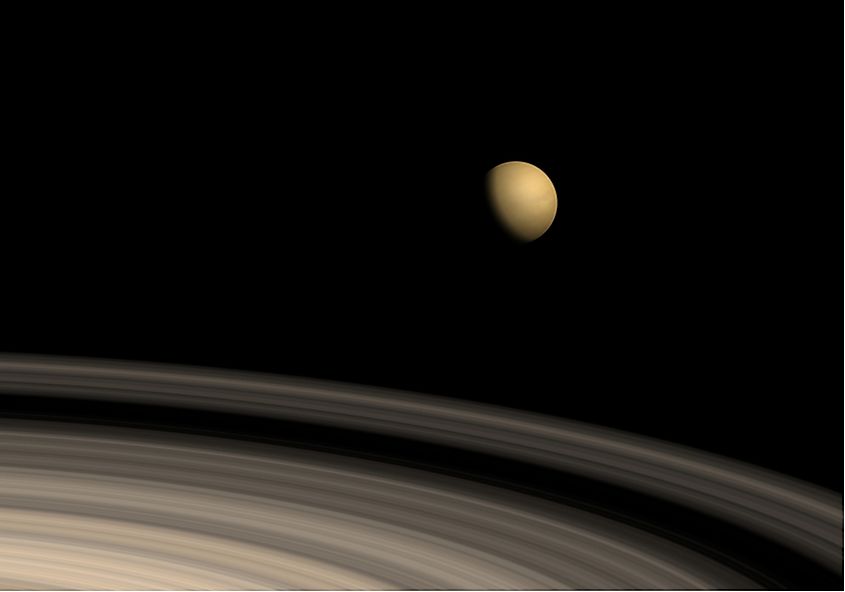Saturn pictured alongside its largest moon, Titan.