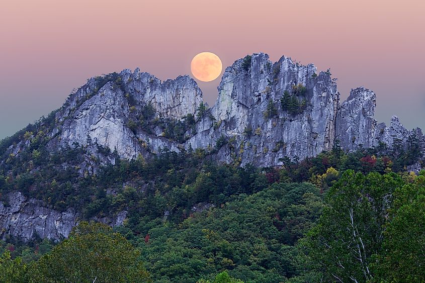 A supermoon rising behind Seneca Rocks in West Virginia