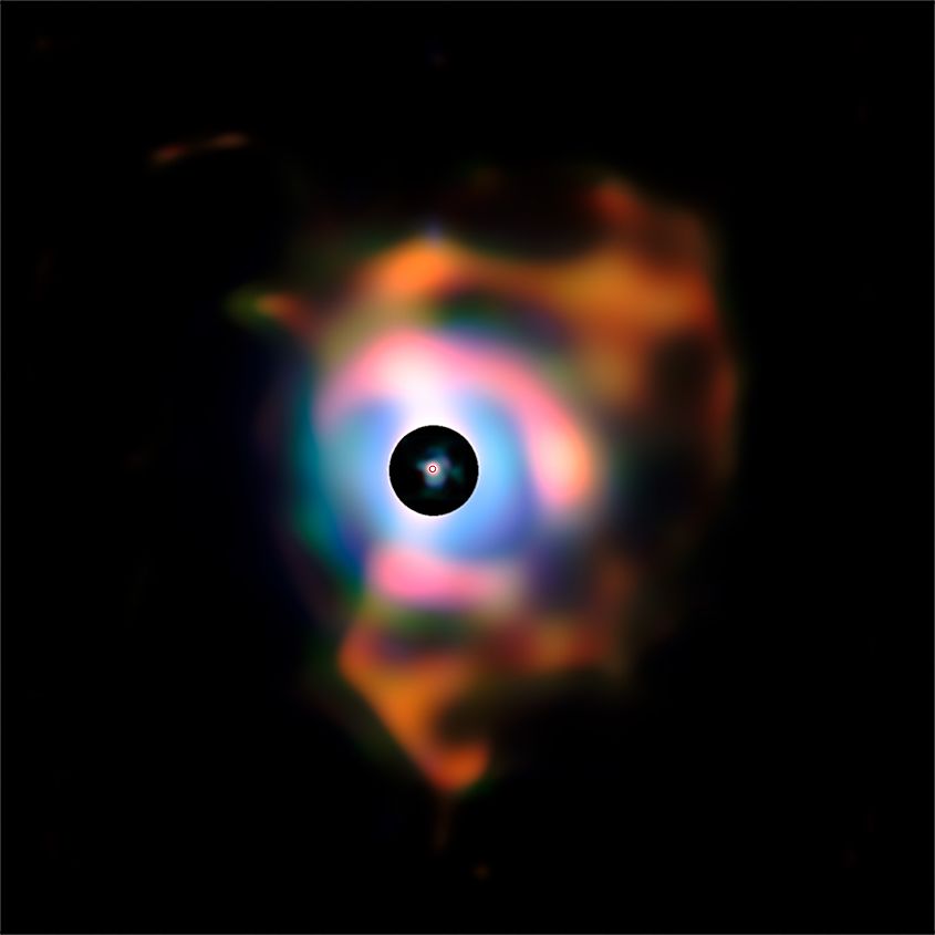 This infrared image from the ESO's VLT shows complex shells of gas and dust around Betelgeuse - the tiny red circle in the middle is the size of the photosphere.