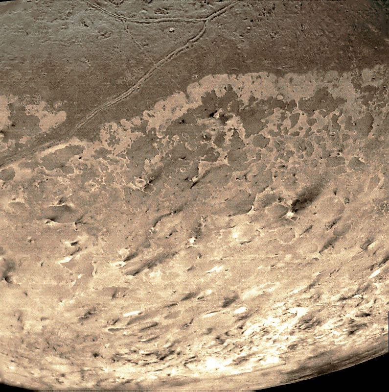 Terrain of Triton photographed by Voyager 2. Editorial credit: NASA, Public Domain, https://commons.wikimedia.org/w/index.php?curid=9919550