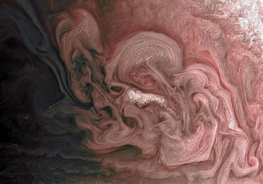A color-enhanced image of a storm in Jupiter's northern hemisphere