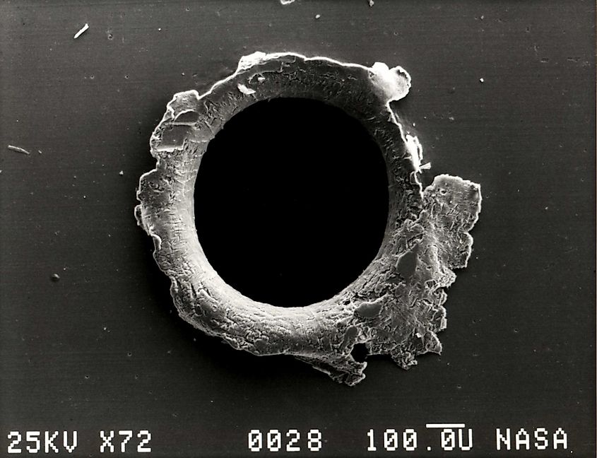 Debris hole in a panel of the SMM Satellite. Editorial credit: NASA, Public Domain, https://commons.wikimedia.org/w/index.php?curid=1371569