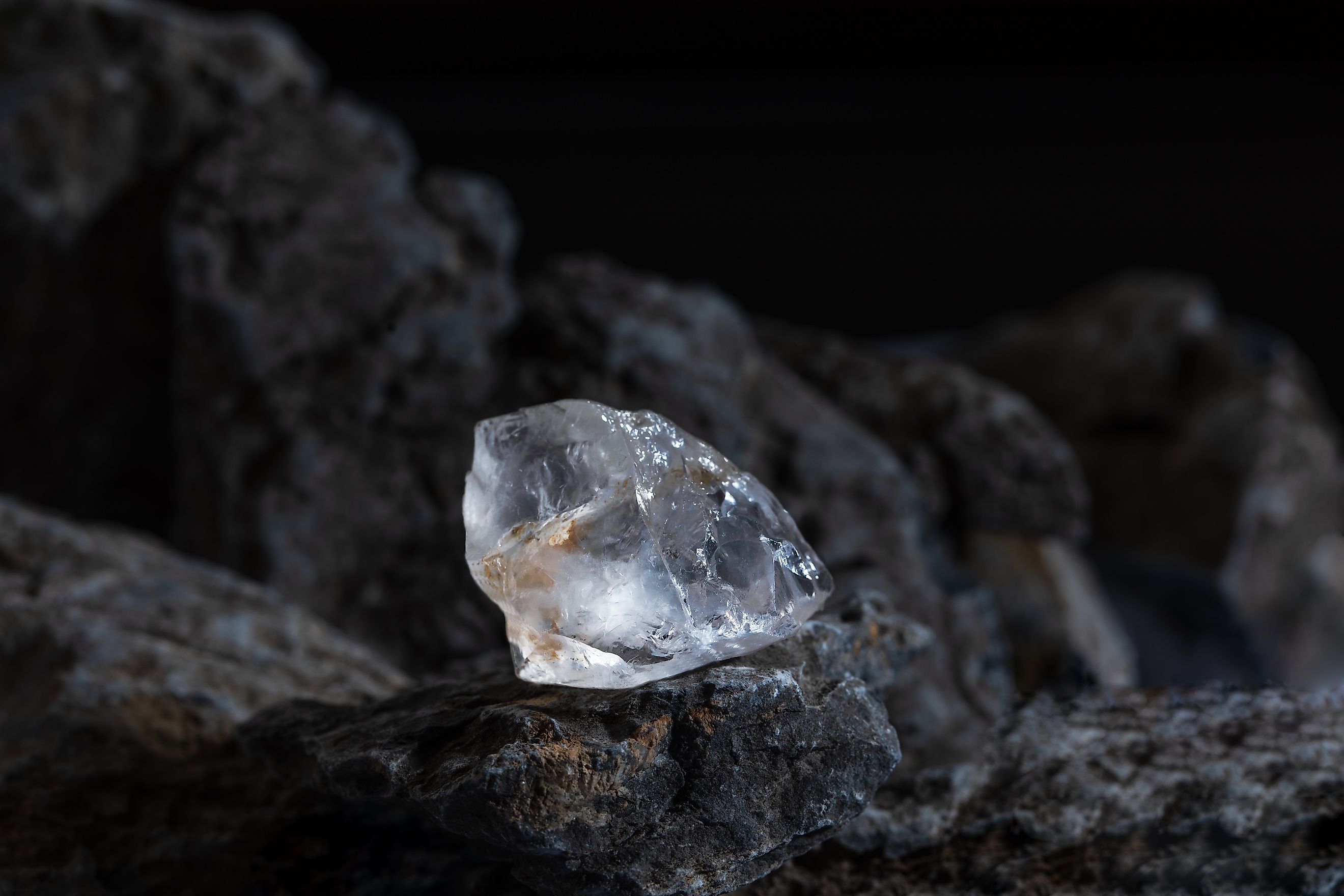 Natural rough diamonds on a pile of rocs close up photography.